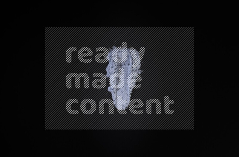 Blue powder smears on black background
