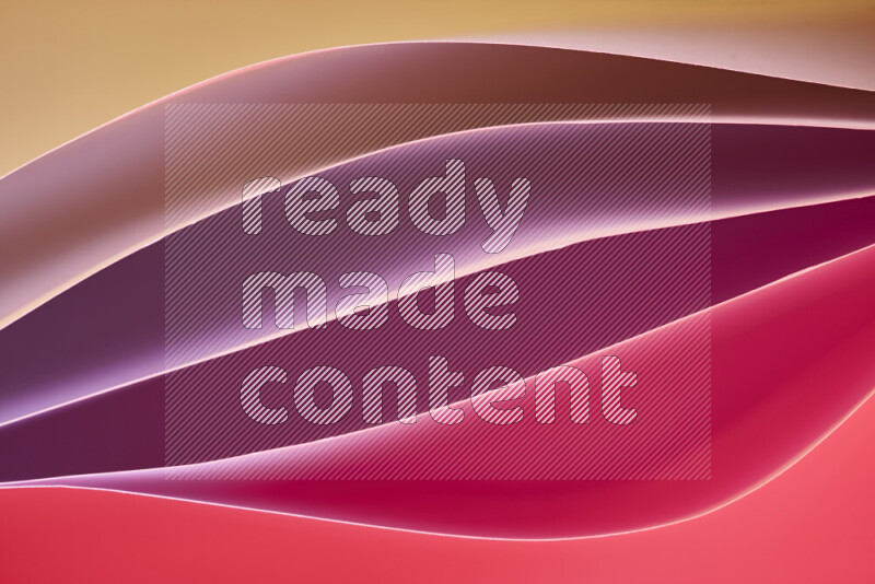 This image showcases an abstract paper art composition with paper curves in different warm gradients created by colored light