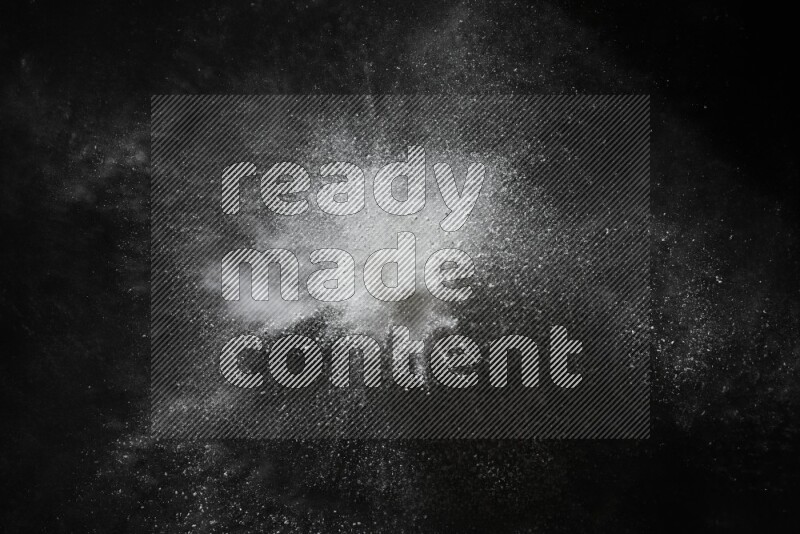 White powder explosion on black background