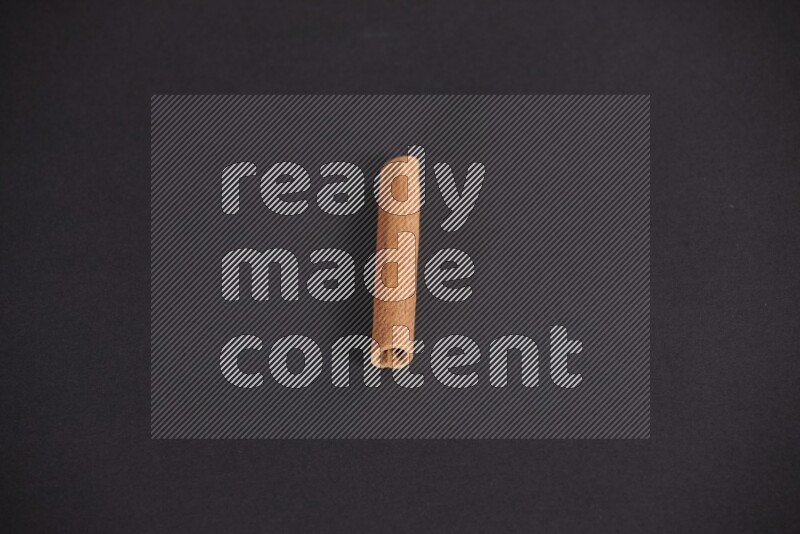 Cinnamon stick on black background
