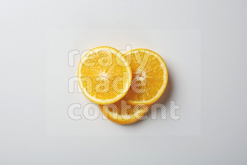 Three orange slices on a white background