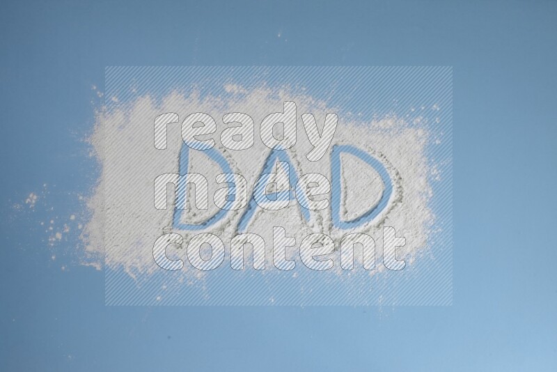 كلمة مكتوبة بمسحوق أبيض على خلفية زرقاء