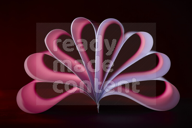 An abstract art piece displaying smooth curves in pink and purple gradients created by colored light