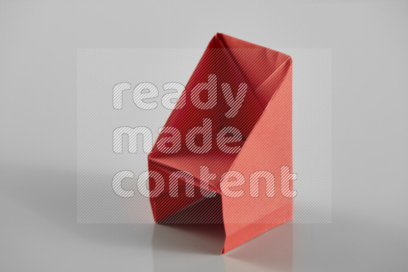 Origami dinning room on grey background