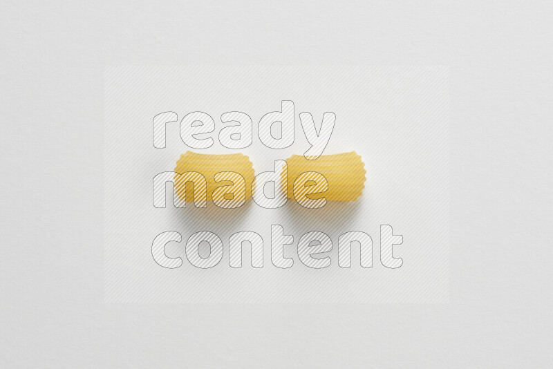 Elbow pasta on white background