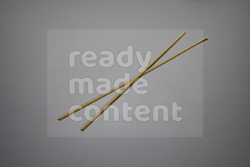 Linguini pasta on grey background