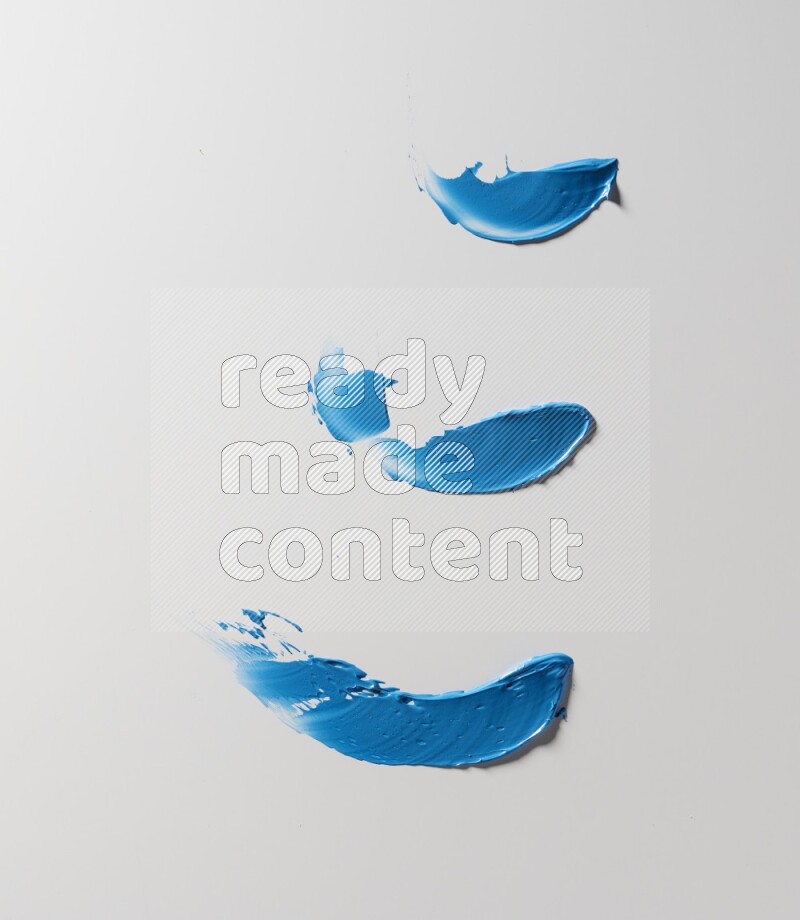 Blue painting knife strokes on white background