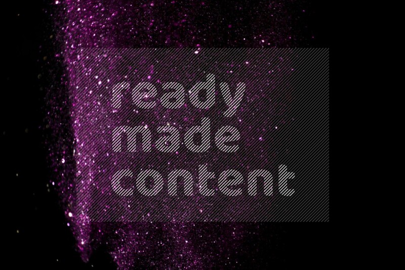 Pink glitter powder isolated on black background