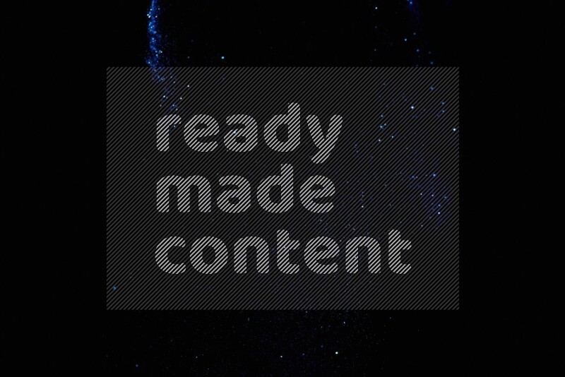 Blue glitter powder isolated on black background