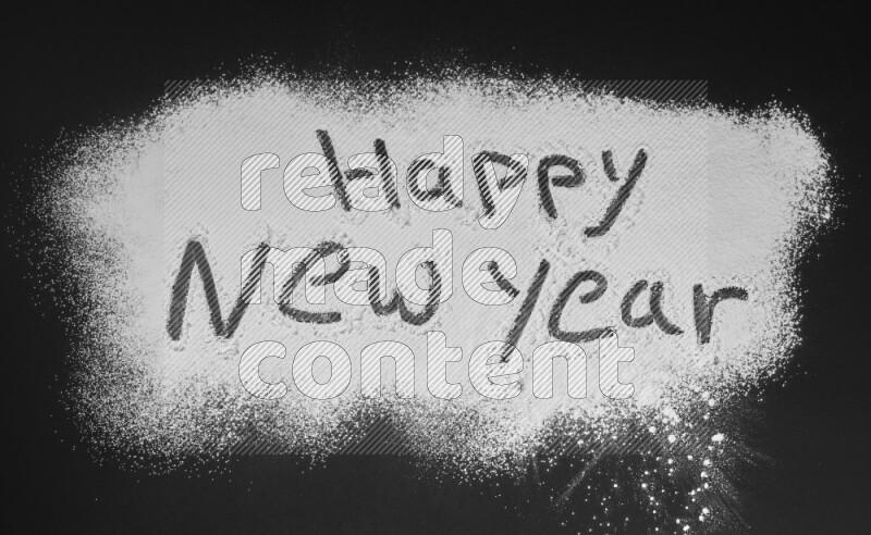 A sentence written with powder on black background