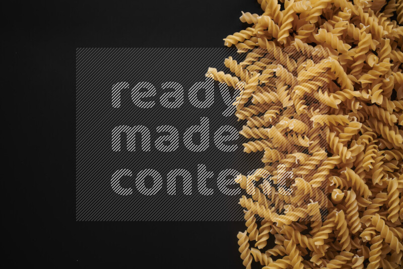 Different pasta types on black background