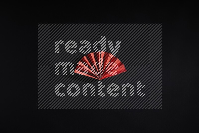 Red paper sheet on black background