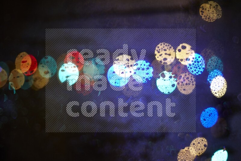 Bokeh light in multicolor with water drops
