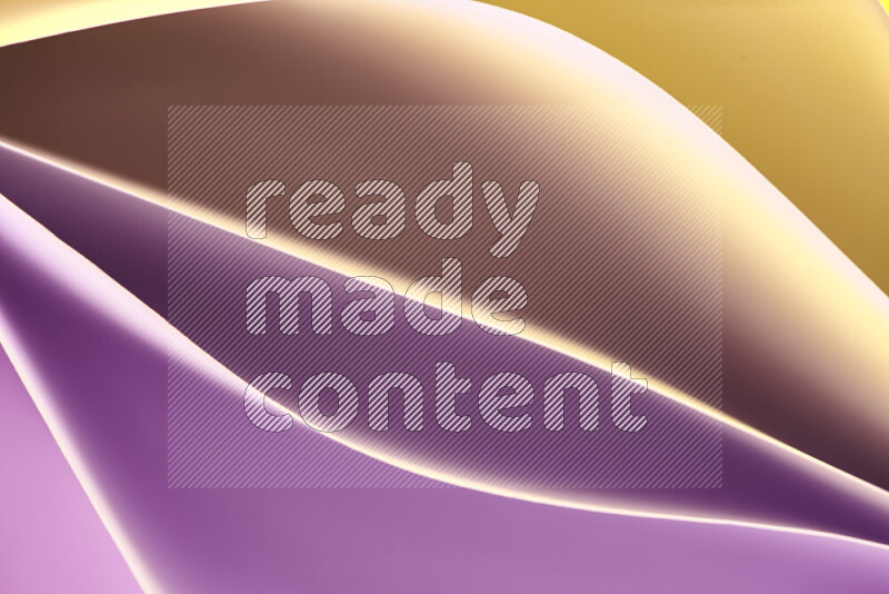 This image showcases an abstract paper art composition with paper curves in purple and gold gradients created by colored light