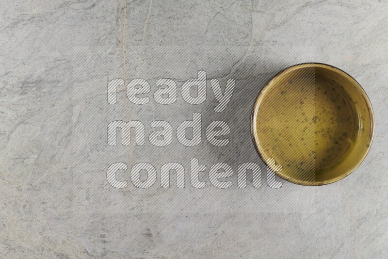 A multicolored pottery Bowl on grey marble background