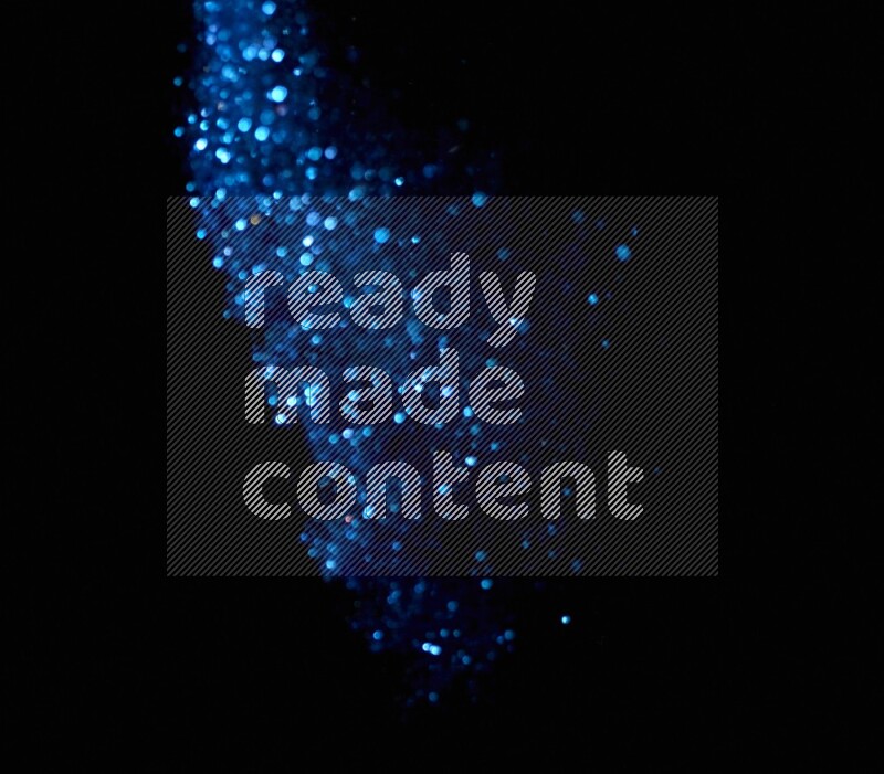 Blue glitter powder isolated on black background