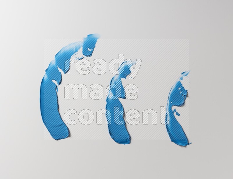 Blue painting knife strokes on white background