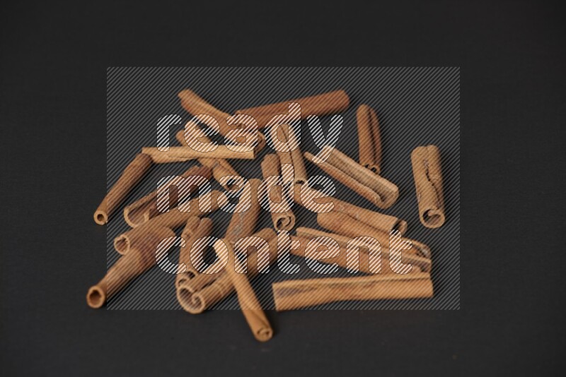 Cinnamon sticks on black background