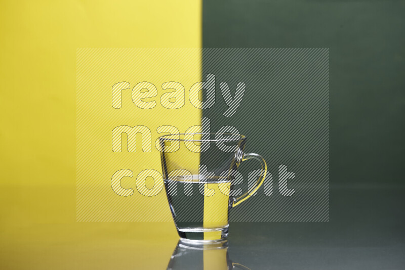 The image features a clear glassware filled with water, set against yellow and dark green background
