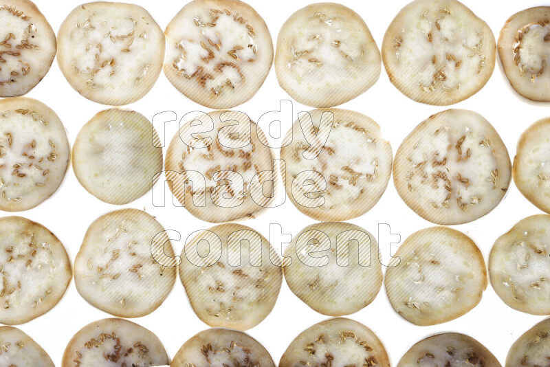 Eggplant slices on illuminated white background