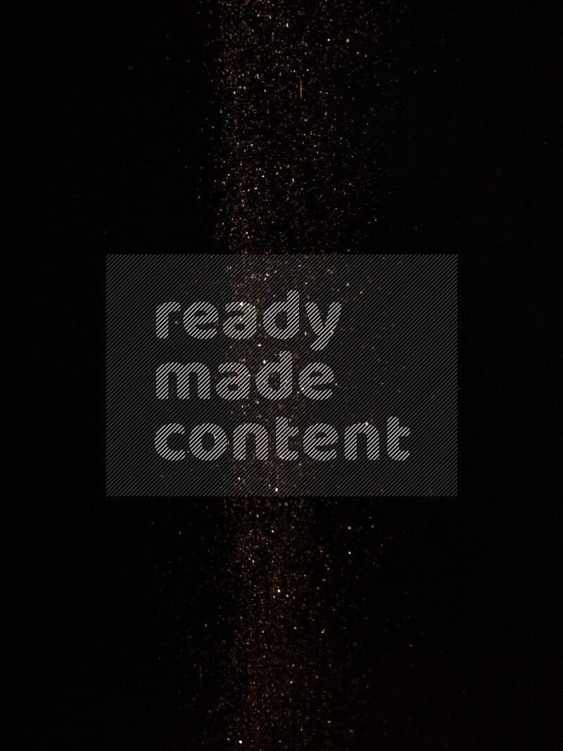 Gold glitter powder isolated on black background