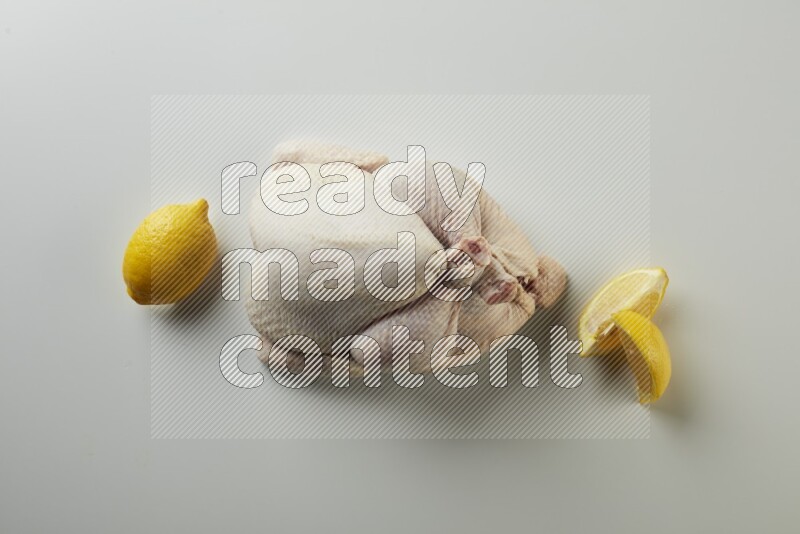 Whole fresh chicken direct on a white background
