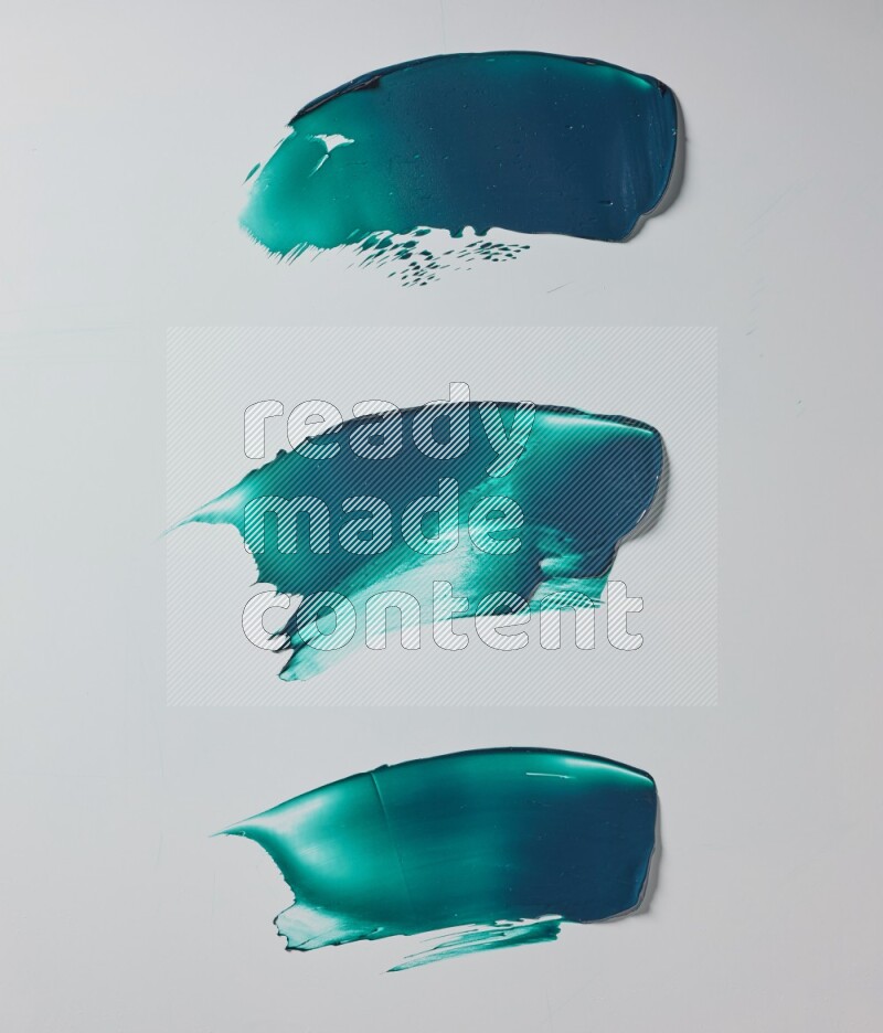 Turquoise painting knife strokes on white background