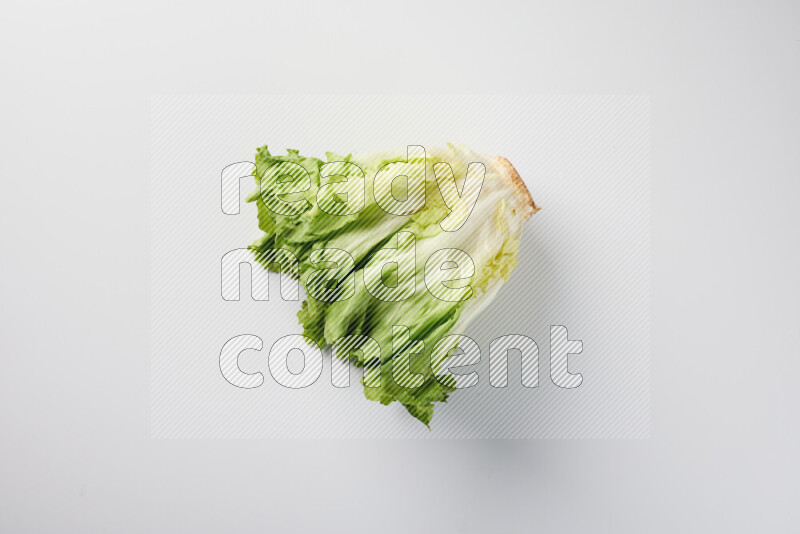 A fresh head of lettuce with green leaves on white background