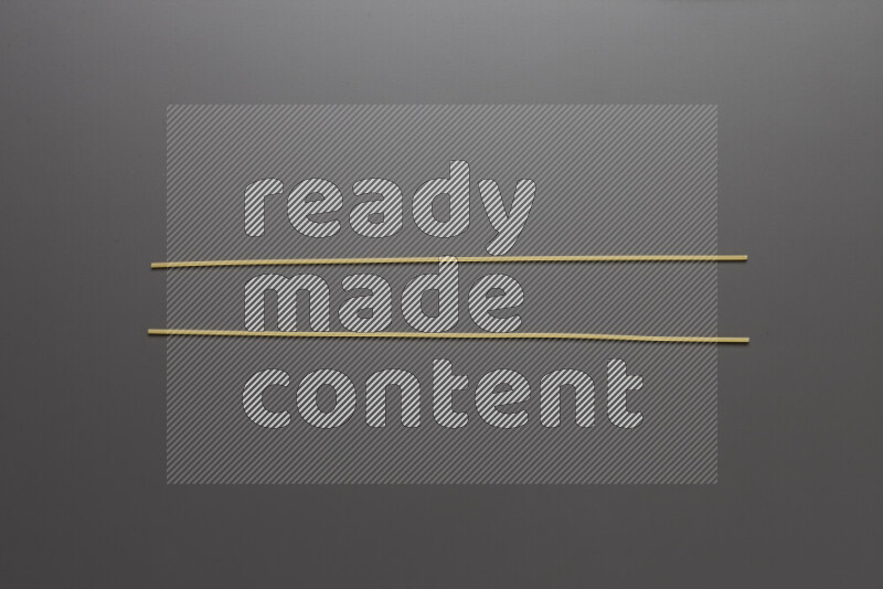 Spaghetti pasta on grey background