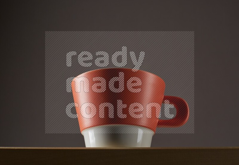 Low angle shot of a bicolor cup on grey background