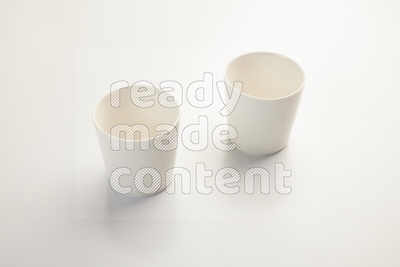 white ceramic cup on white countertop