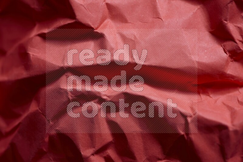 Crumpled craft paper on black background