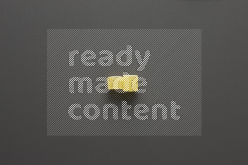 Big rings pasta on grey background