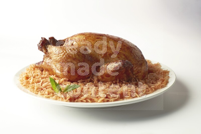 red basmati Rice with  whole roasted chicken on a white rounded plate  direct  on white background