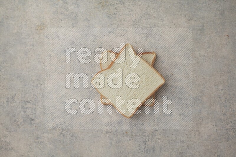 White Toast slices on alight blue textured background