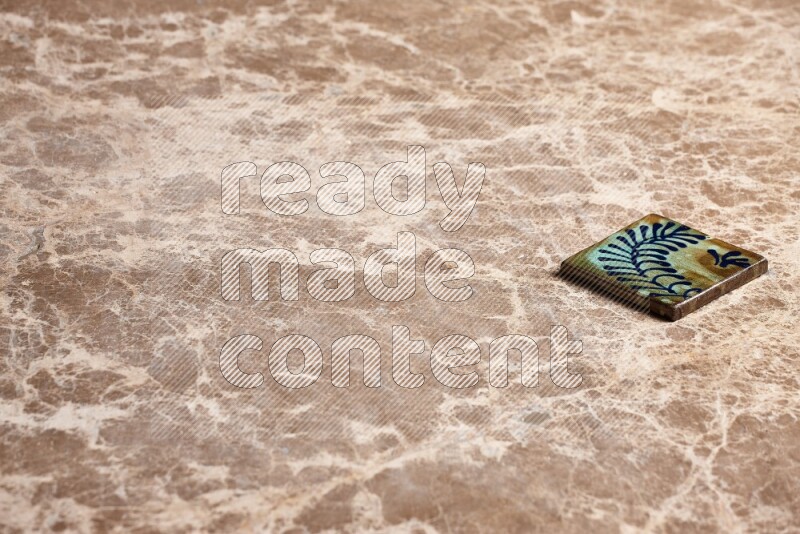 A decorative coaster on beige marble background