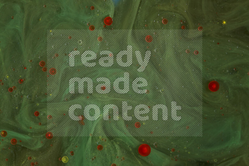 The image captures a dramatic splatter of red paint over a green backdrop