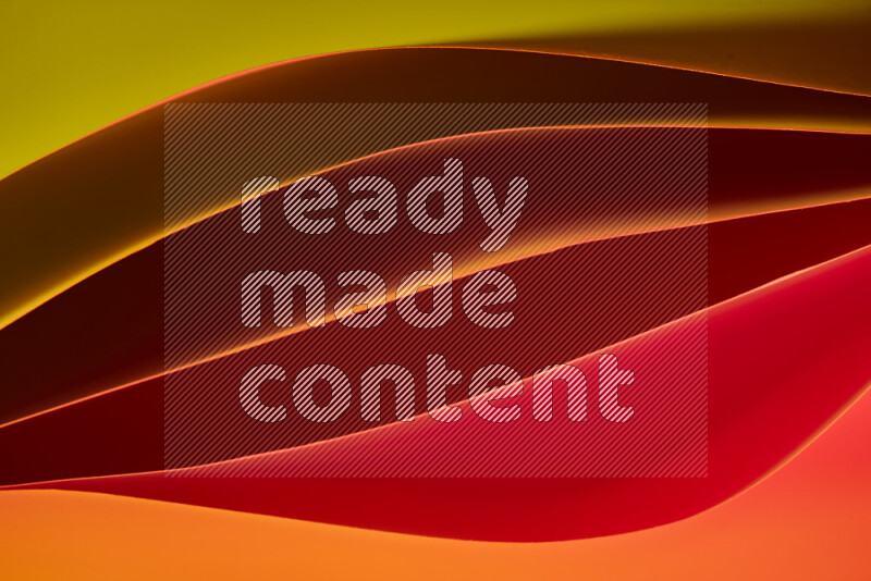 This image showcases an abstract paper art composition with paper curves in different warm gradients created by colored light