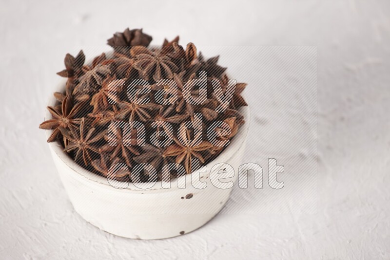 Star Anise in a white bowl on white background