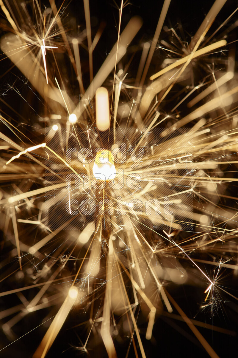 A close-up image of sparkler candle isolated on black background