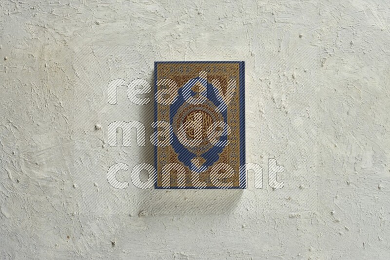Quran with a prayer beads on white background