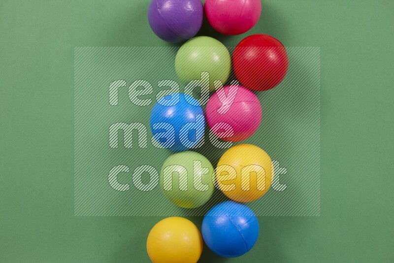 Multicolored plastic balls on different colored backgrounds (kids toys)