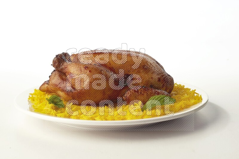 yellow  basmati Rice with  whole roasted chicken on a white rounded plate direct on white background