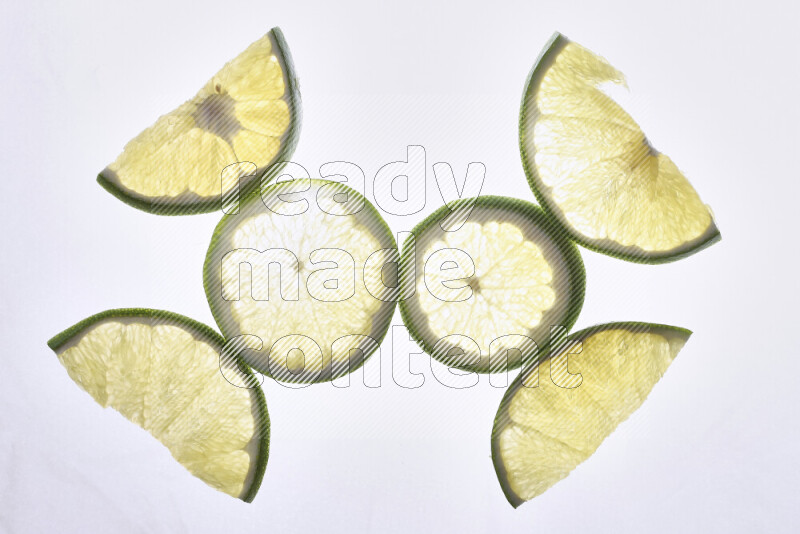 Orange slices on illuminated white background