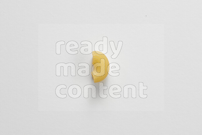 Elbow pasta on white background