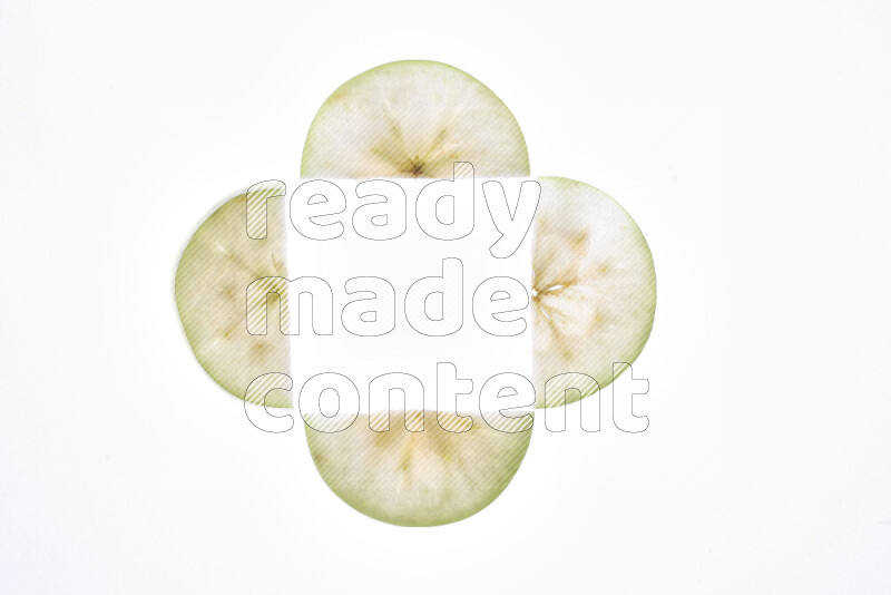 Apple slices on illuminated white background
