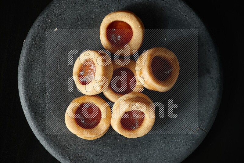 Jam cookies on a black background