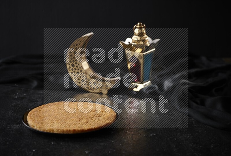 Konafa with lanterns in a dark setup