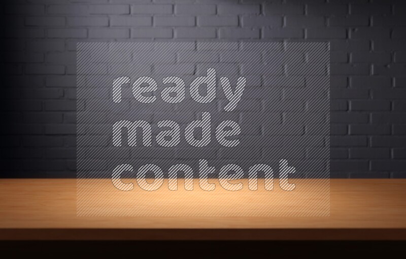 A wooden table top with colored brick wall background