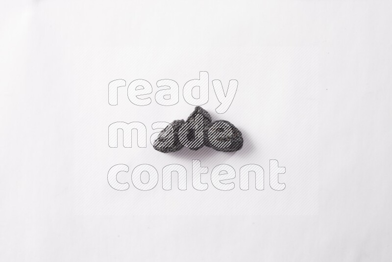Dried plums on white background